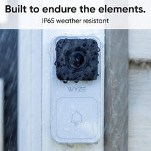 Wyze Video Doorbell Wired installed on a door in the color white